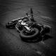 Motorcycle lying on its side on a paved road